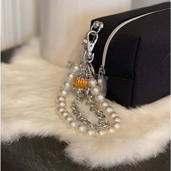 Dior black “CD” raised emblem silver & pearl wristlet & carriage keychain